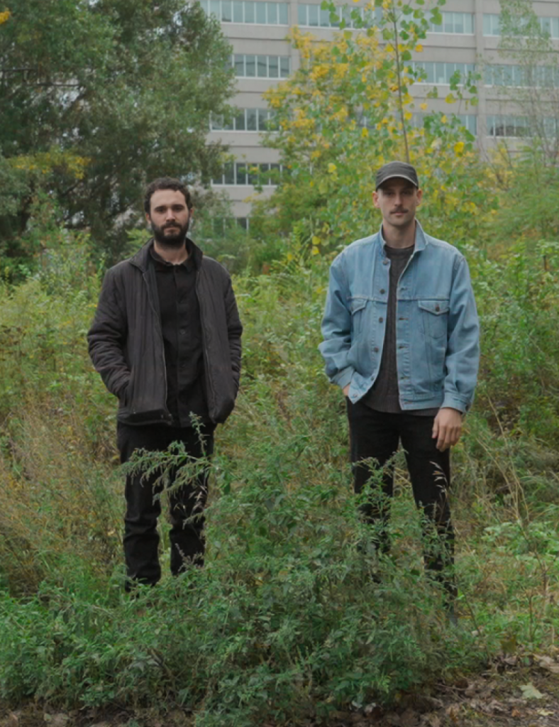 Nouveaux Voisins posing in a urban forest.