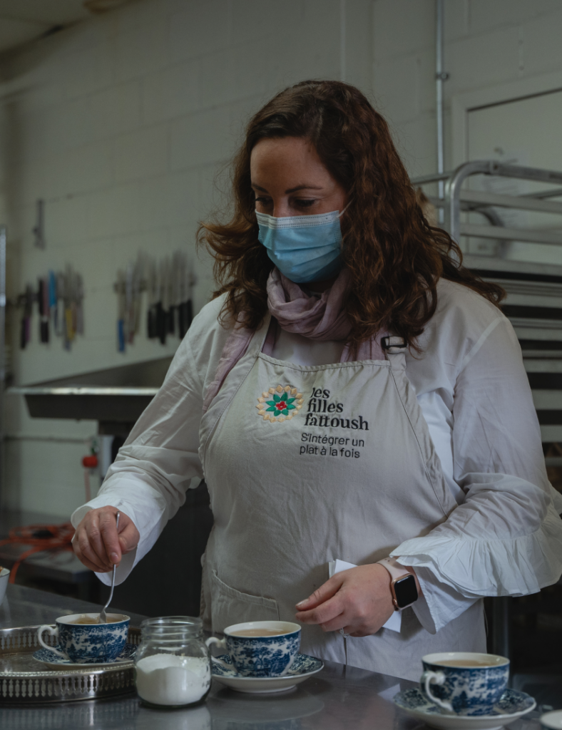 A member of Filles Fattoush preparing tea.