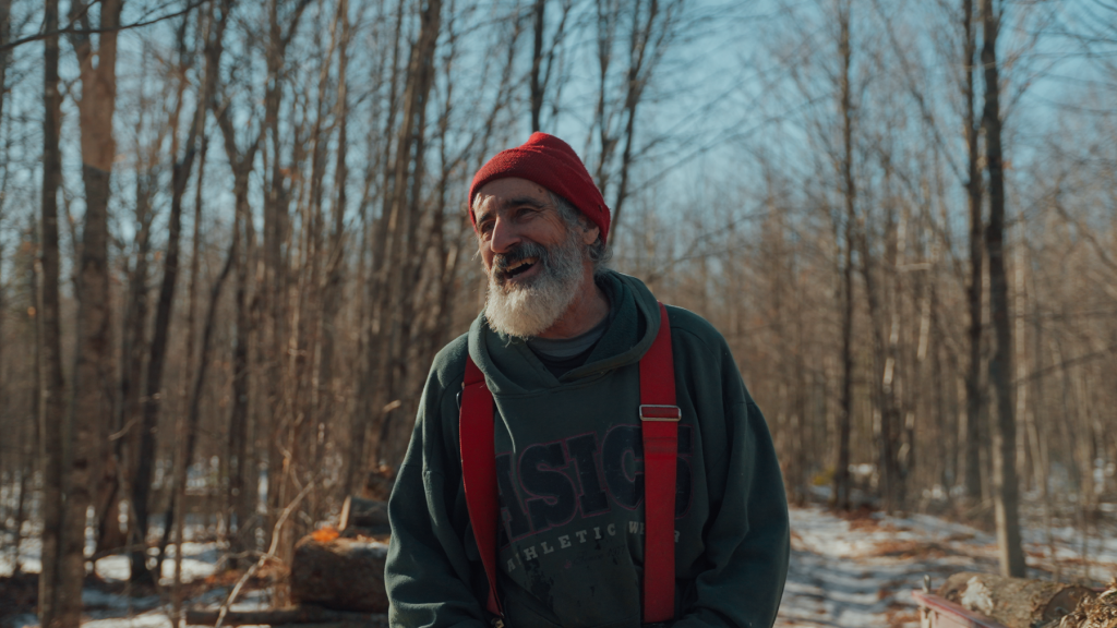 Gaetan, smiling, in Saint-Adrien forest.